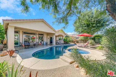 a view of a house with swimming pool