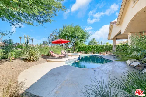 a view of a swimming pool with a patio