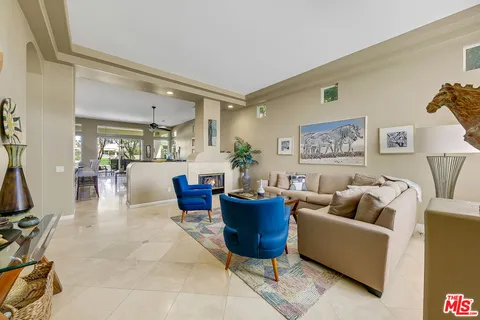 a living room with furniture rug and window