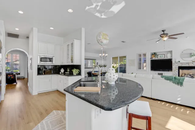 a kitchen with a center island and appliances