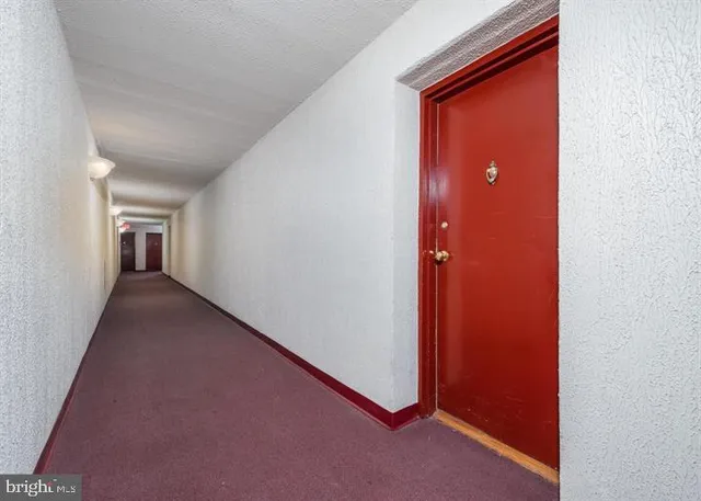 a view of a hallway with closet