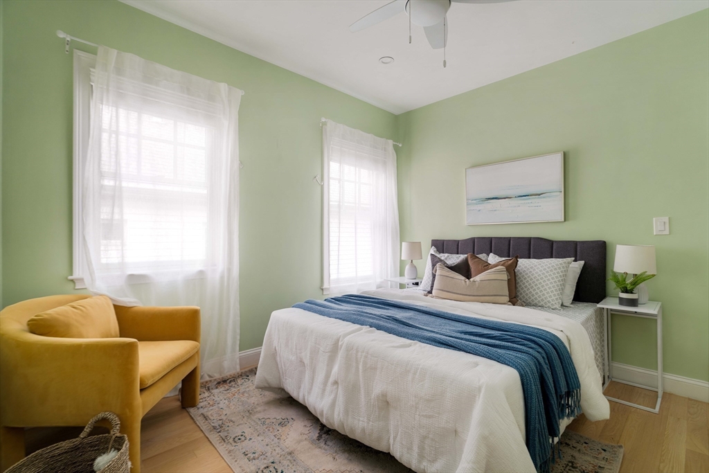 6 Hamilton Road, Unit 6 Somerville, MA 02144 - Photo 16 of 28 a bedroom with a bed and a couch