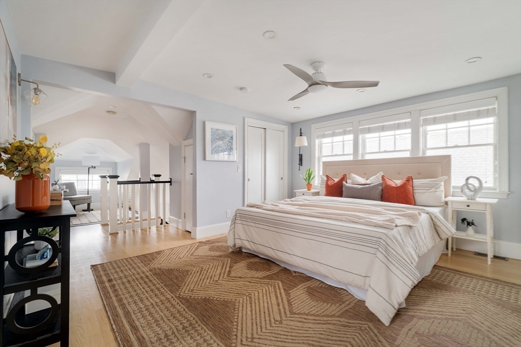 6 Hamilton Road, Unit 6 Somerville, MA 02144 - Photo 21 of 28 a spacious bedroom with a bed and wooden floor