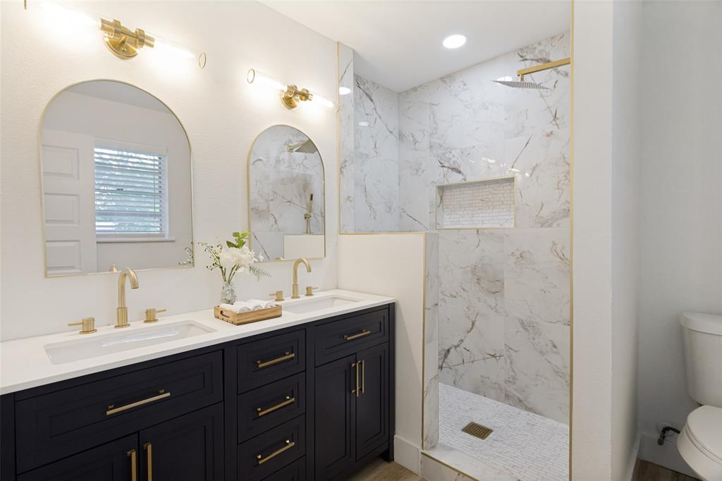 3816 Springbranch Drive Benbrook, TX 76116 - Photo 17 of 25 a bathroom with a double vanity sink mirror double shower and a mirror