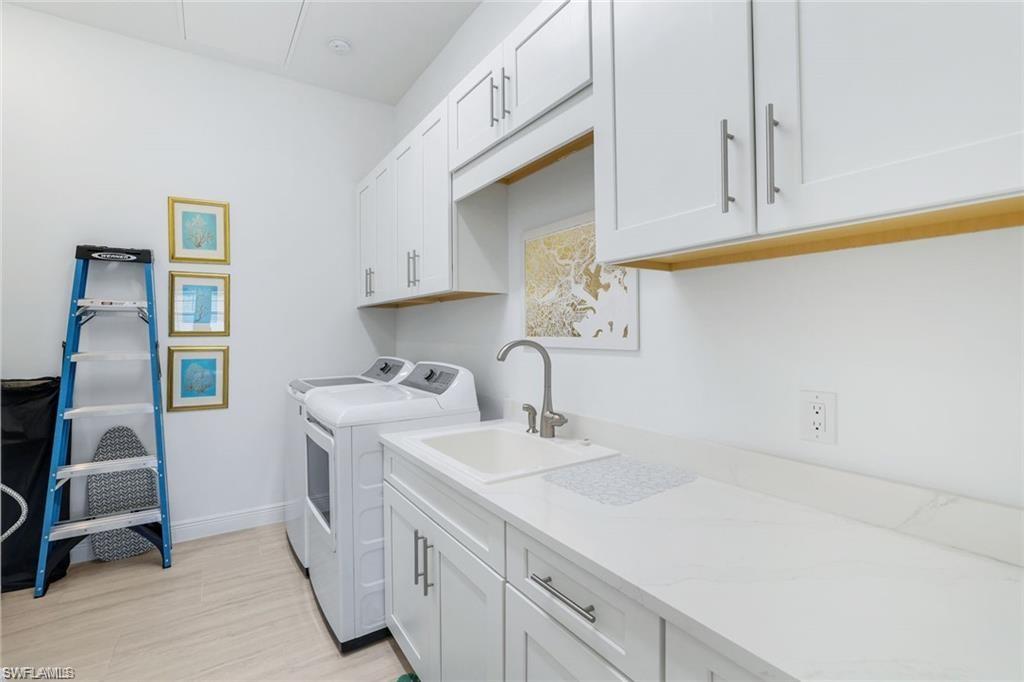 16374 Viansa Way, Unit 5302 Naples, FL 34110 - Photo 18 of 28 Laundry room washer, dryer and utility tub