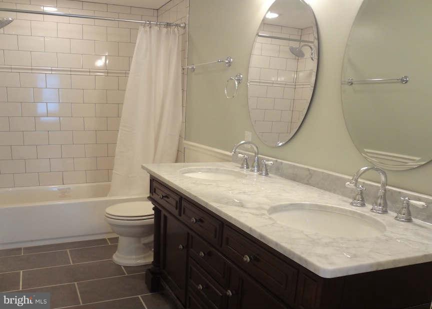 3037 Keswick Road Baltimore, MD 21211 - Photo 21 of 30 Marble Double Vanity w/ Drawers & Doors