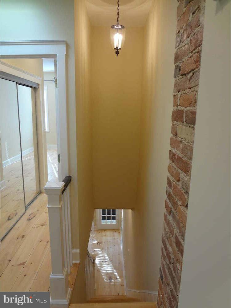 3037 Keswick Road Baltimore, MD 21211 - Photo 22 of 30 2nd Floor Hall w/ Skylight & Exposed Brick
