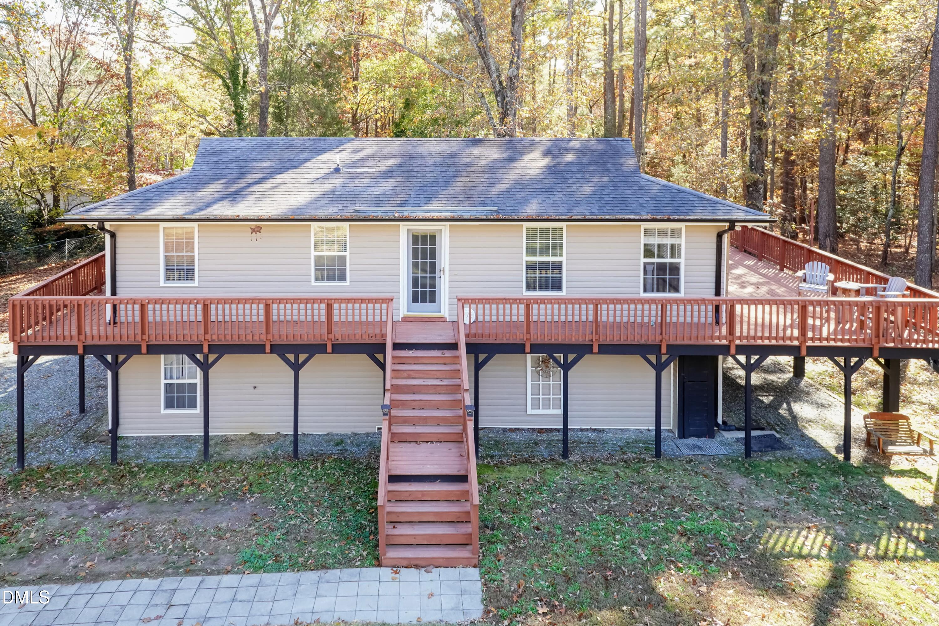 137 Fox Hunters Lane Broadway, NC 27505 - Photo 1 of 46 a view of a house with a yard and roof