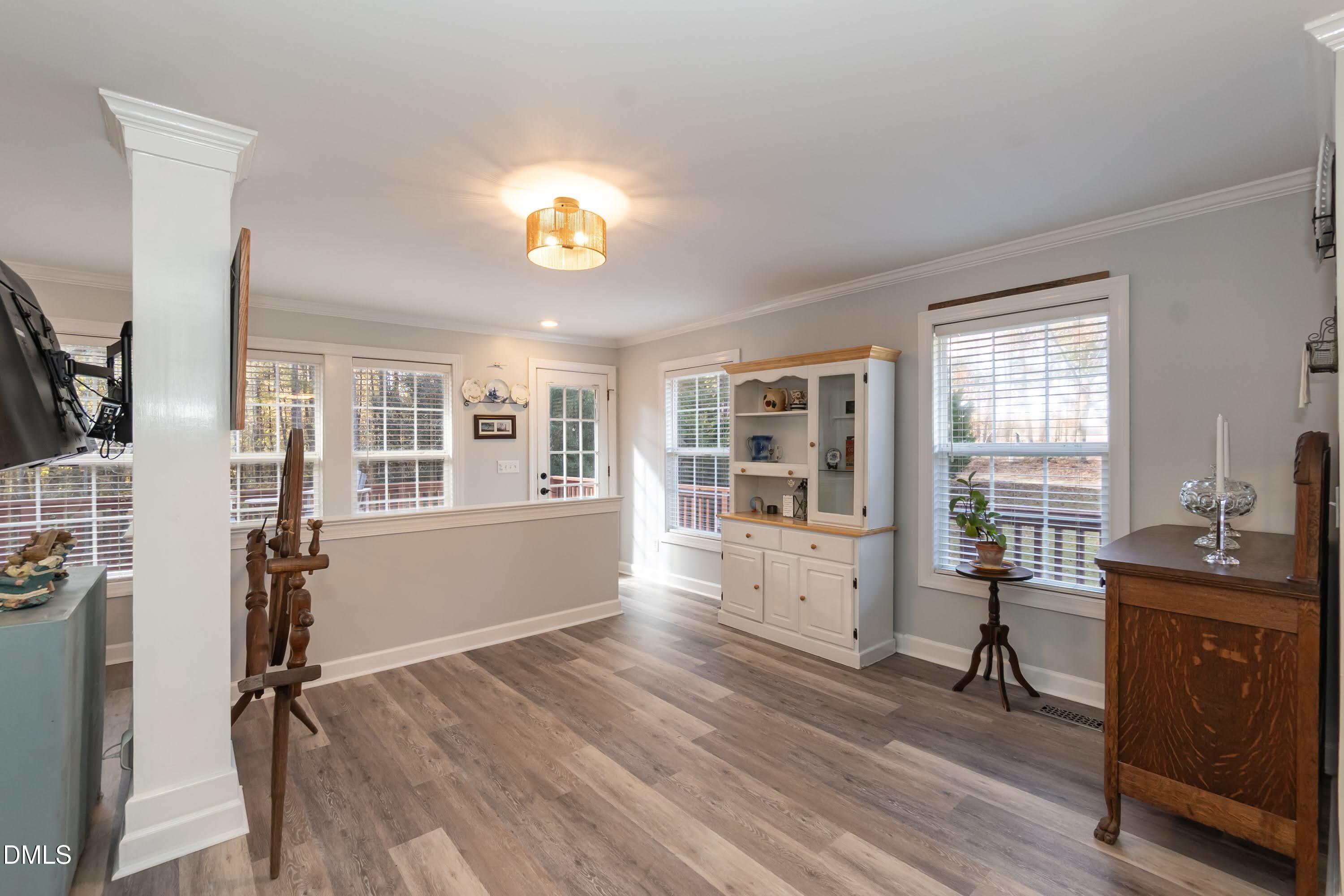 137 Fox Hunters Lane Broadway, NC 27505 - Photo 12 of 46 a view of a livingroom with wooden floor and furniture