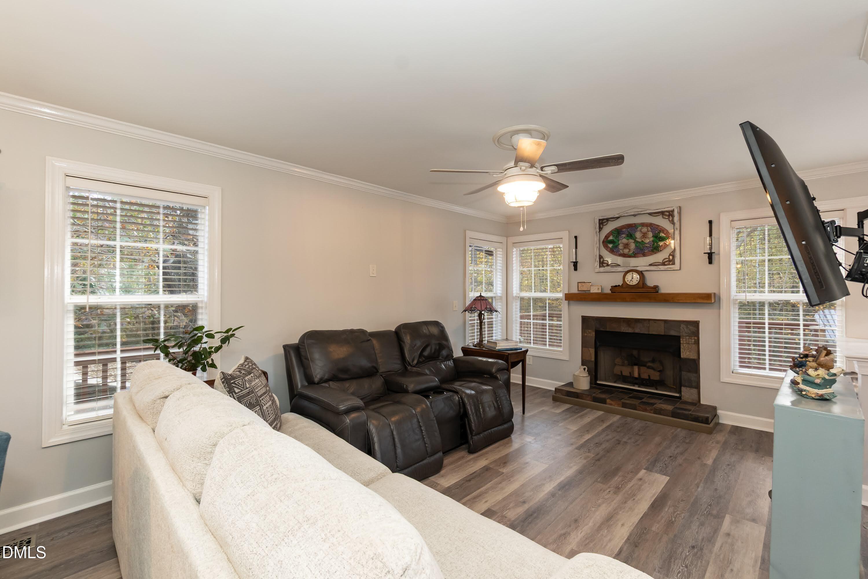 137 Fox Hunters Lane Broadway, NC 27505 - Photo 14 of 46 a living room with furniture and a fireplace