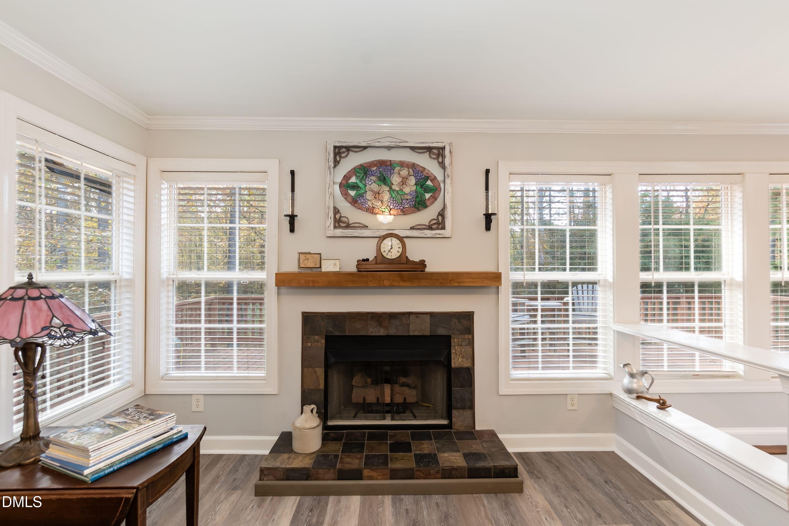 137 Fox Hunters Lane Broadway, NC 27505 - Photo 17 of 46 a living room with furniture a window and a fireplace