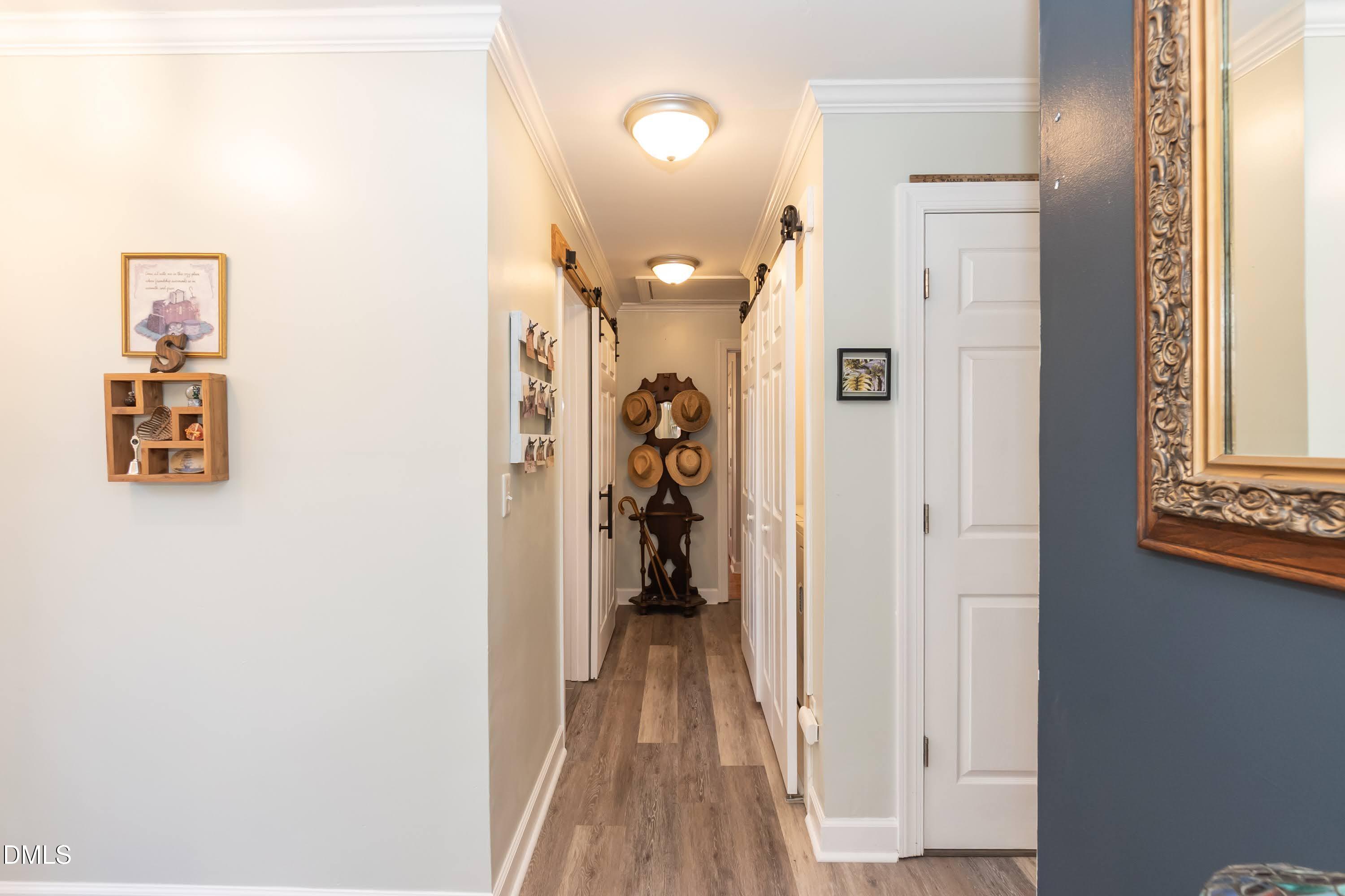 137 Fox Hunters Lane Broadway, NC 27505 - Photo 18 of 46 a view of a hallway with wooden floor and closet