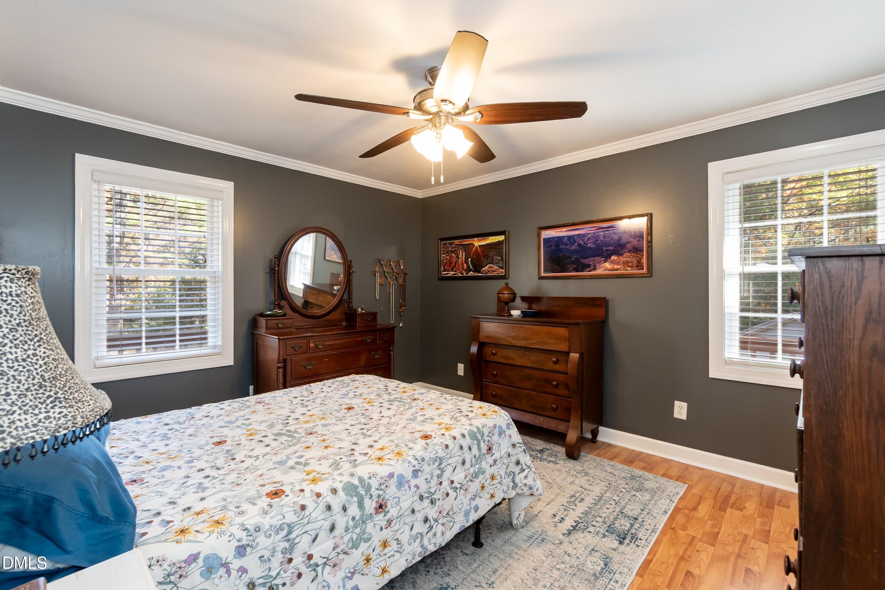 137 Fox Hunters Lane Broadway, NC 27505 - Photo 22 of 46 a bedroom with a bed dresser and a flat tv screen