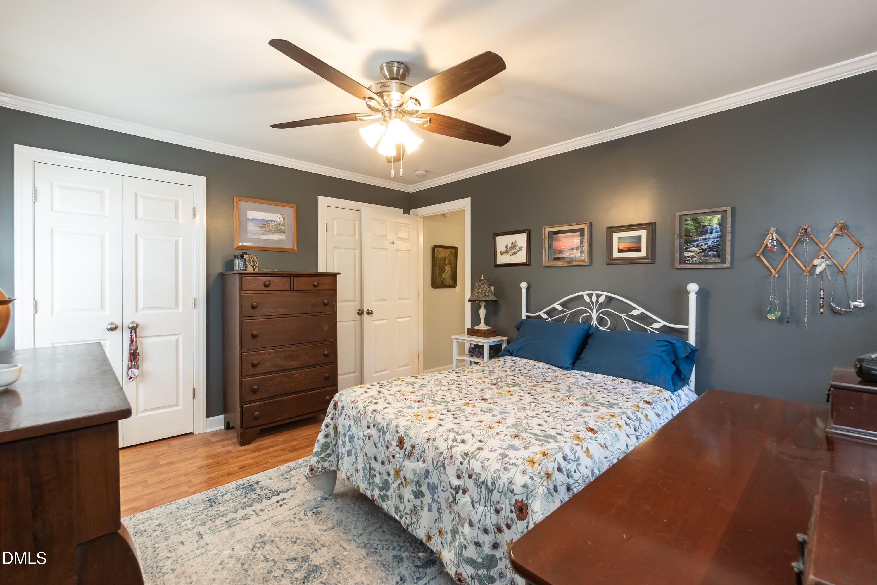 137 Fox Hunters Lane Broadway, NC 27505 - Photo 23 of 46 a bedroom with a bed and a dresser