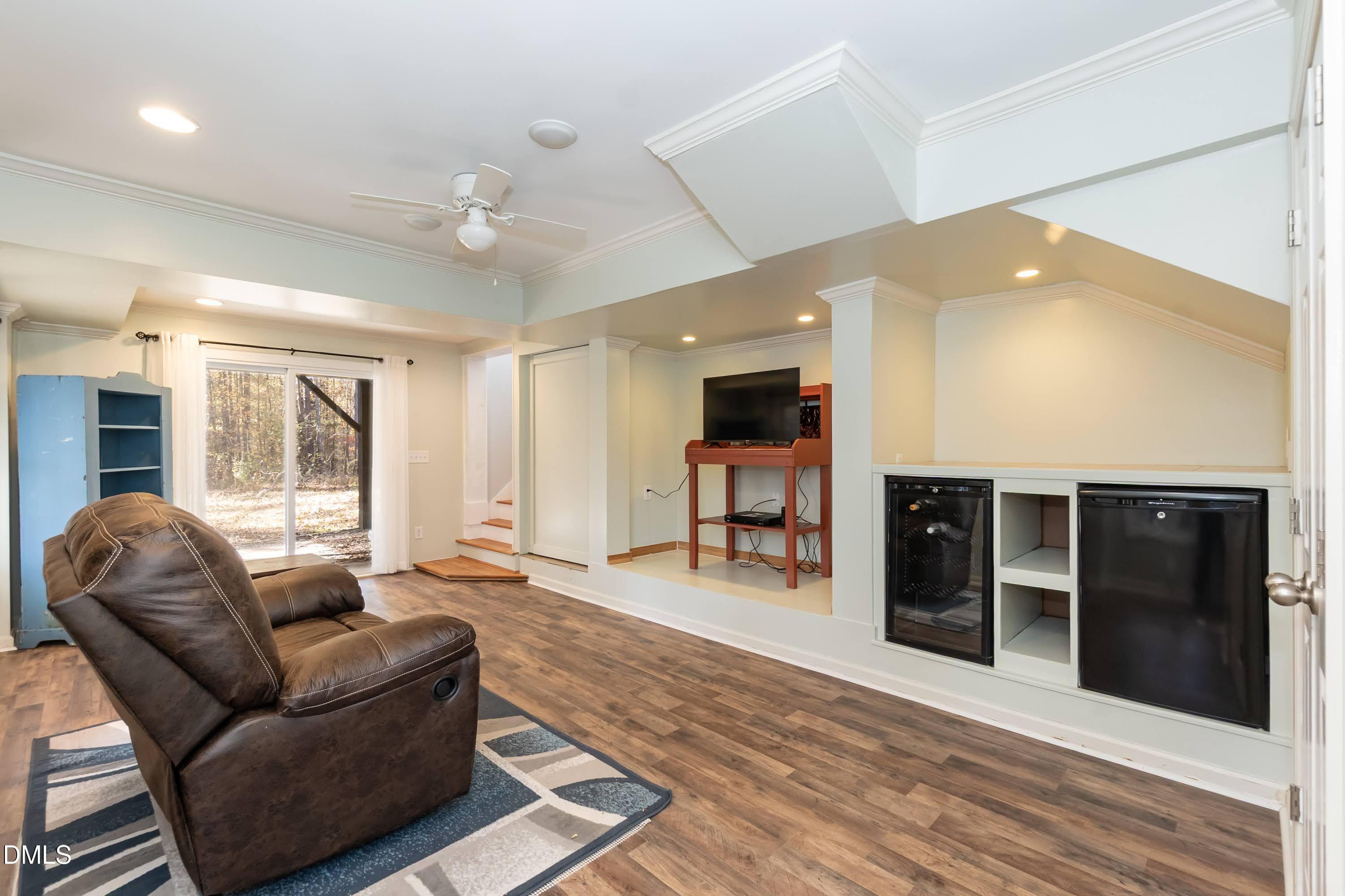 137 Fox Hunters Lane Broadway, NC 27505 - Photo 28 of 46 a living room with furniture and large windows