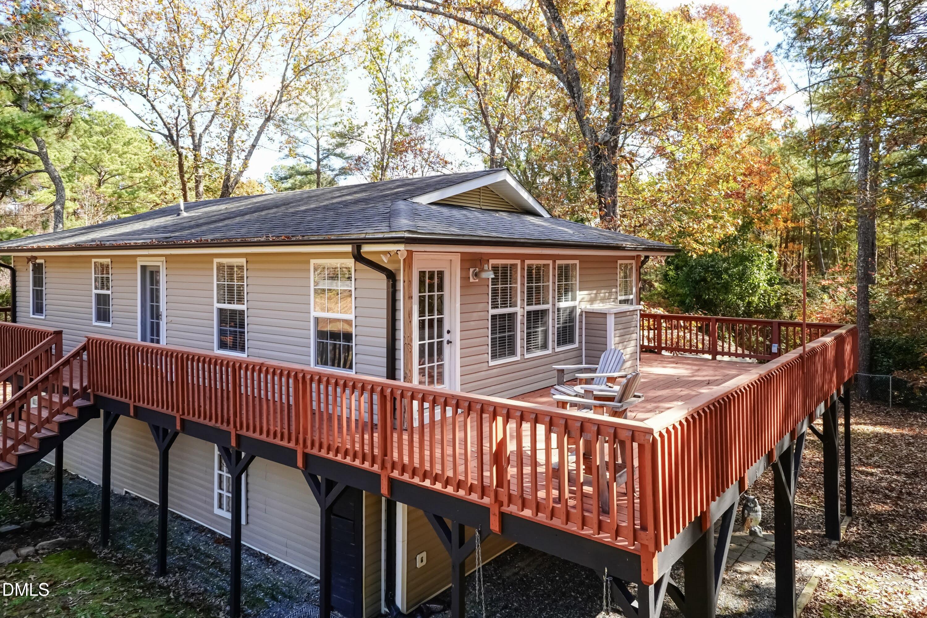 137 Fox Hunters Lane Broadway, NC 27505 - Photo 40 of 46 a roof deck with table and chairs