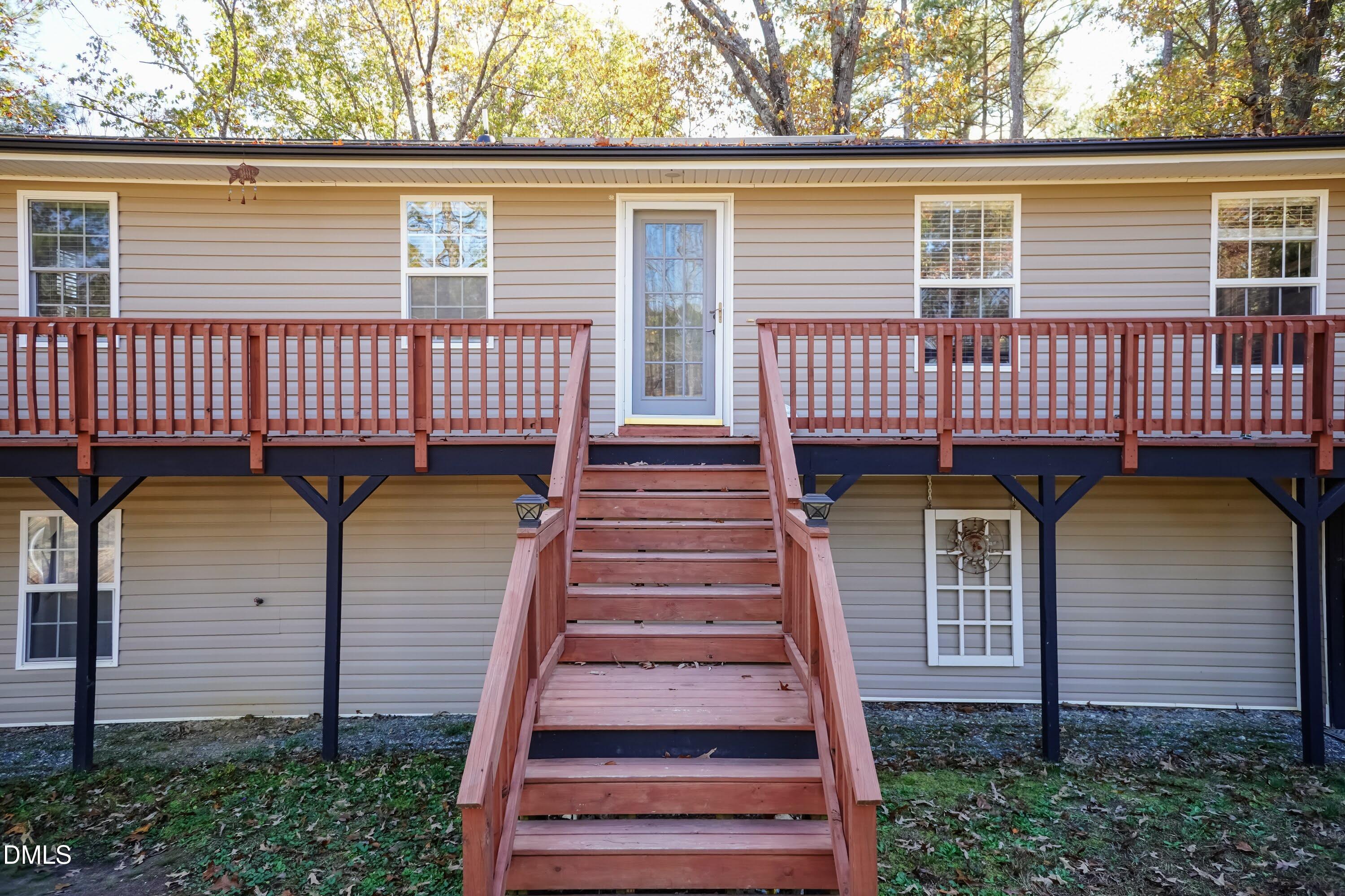 137 Fox Hunters Lane Broadway, NC 27505 - Photo 4 of 46 a front view of a house with a garden