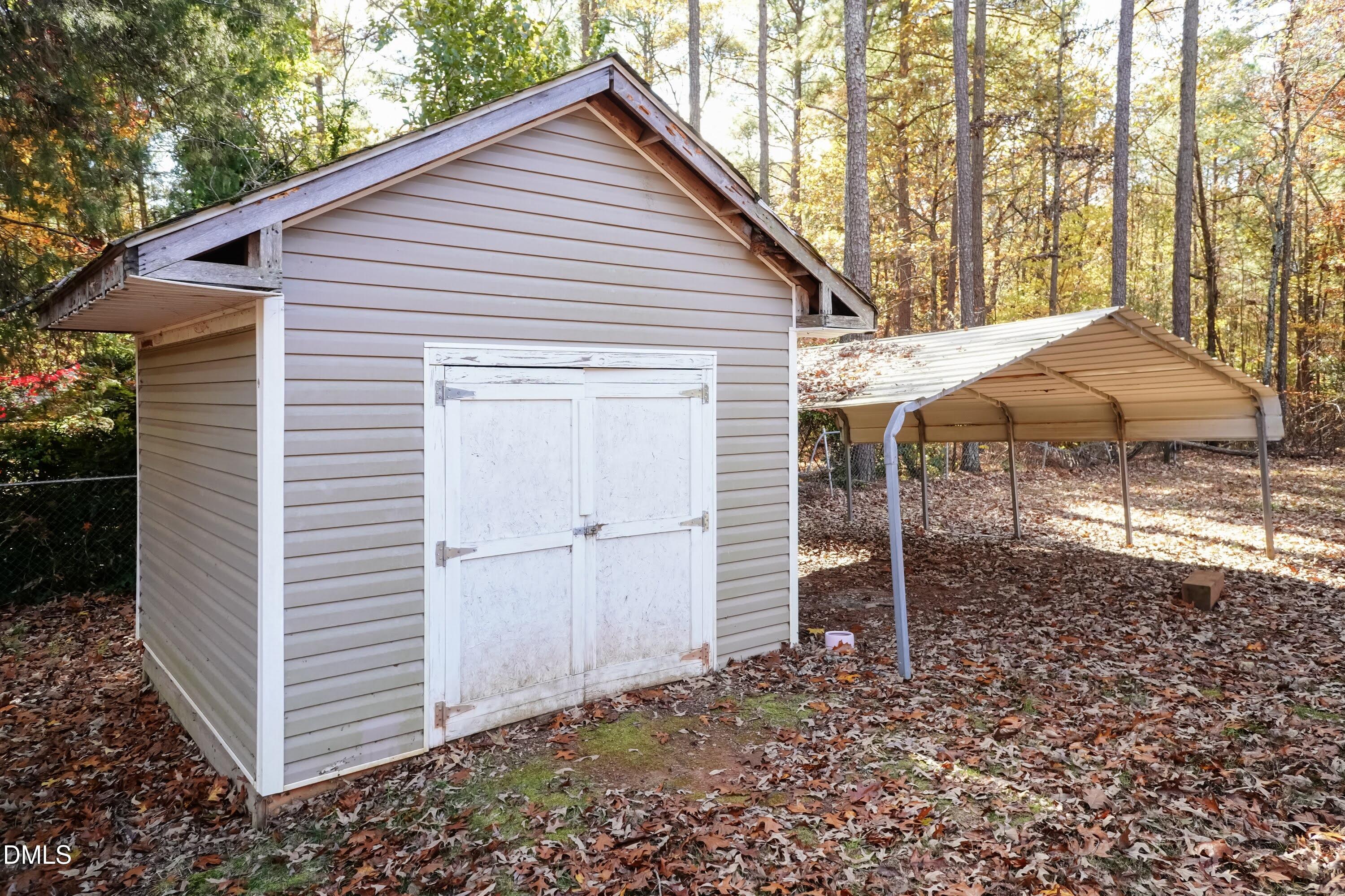 137 Fox Hunters Lane Broadway, NC 27505 - Photo 44 of 46 a front view of a house with a yard