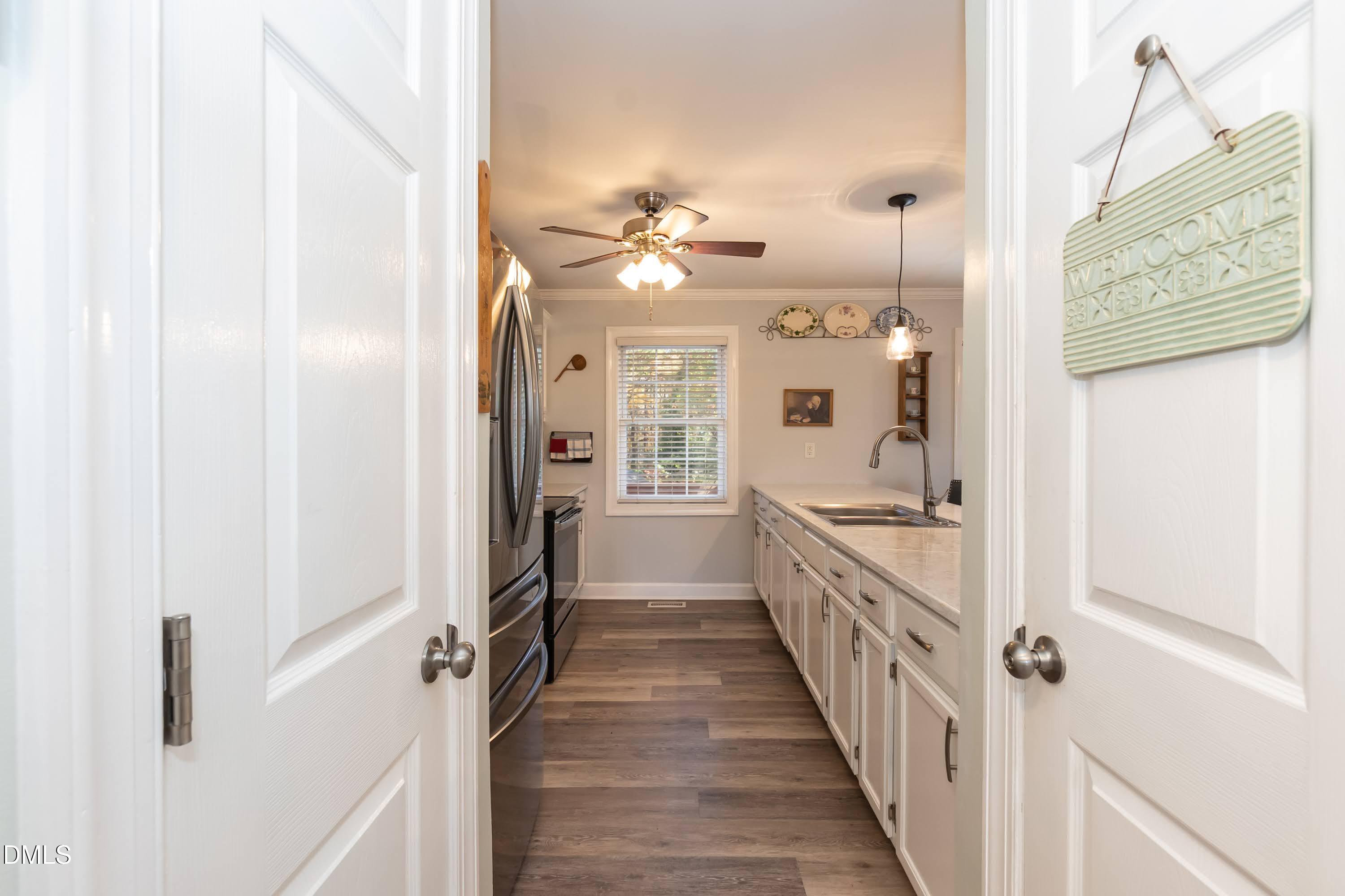 137 Fox Hunters Lane Broadway, NC 27505 - Photo 8 of 46 a view of a hallway with a chandelier