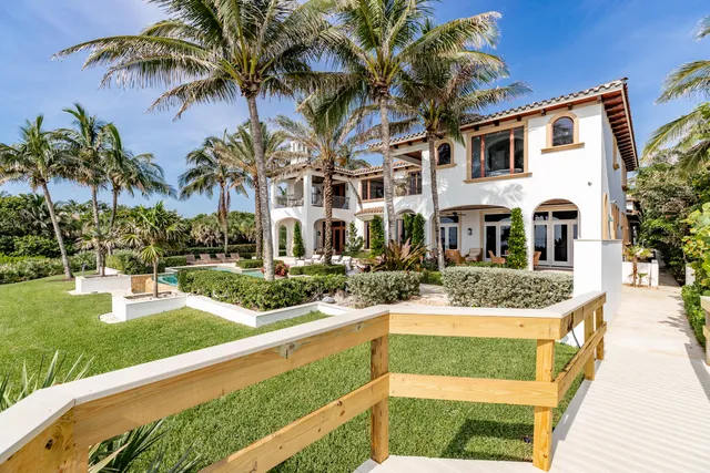 a bedroom with bed and wooden floor