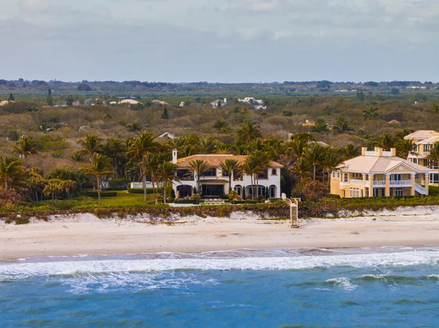 a view of swimming pool with outdoor seating and plants
