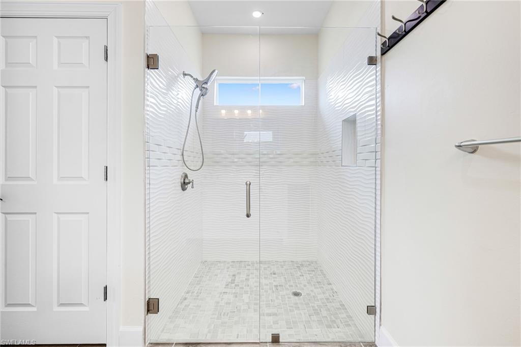 4909 Berryman Street Lehigh Acres, FL 33971 - Photo 20 of 30 Bathroom featuring a shower stall