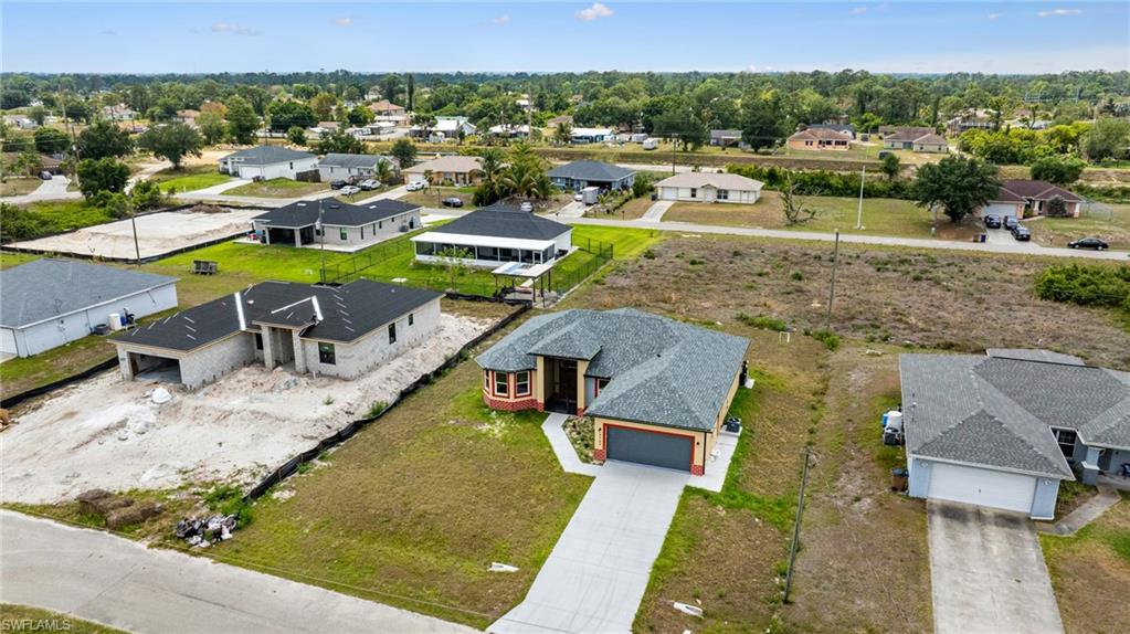 4909 Berryman Street Lehigh Acres, FL 33971 - Photo 27 of 30 Aerial perspective of suburban area
