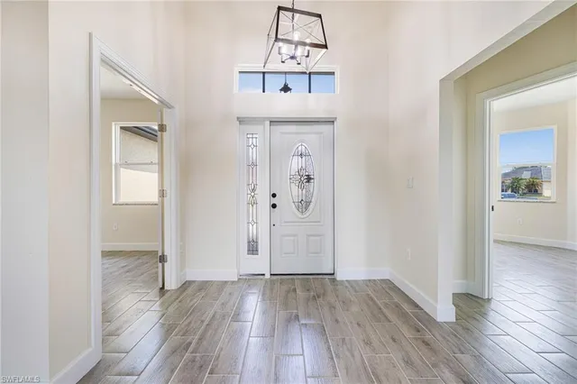 wooden floor in a hall with a window