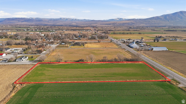 View of rural area featuring a mountainous background and property boundaries highlighted