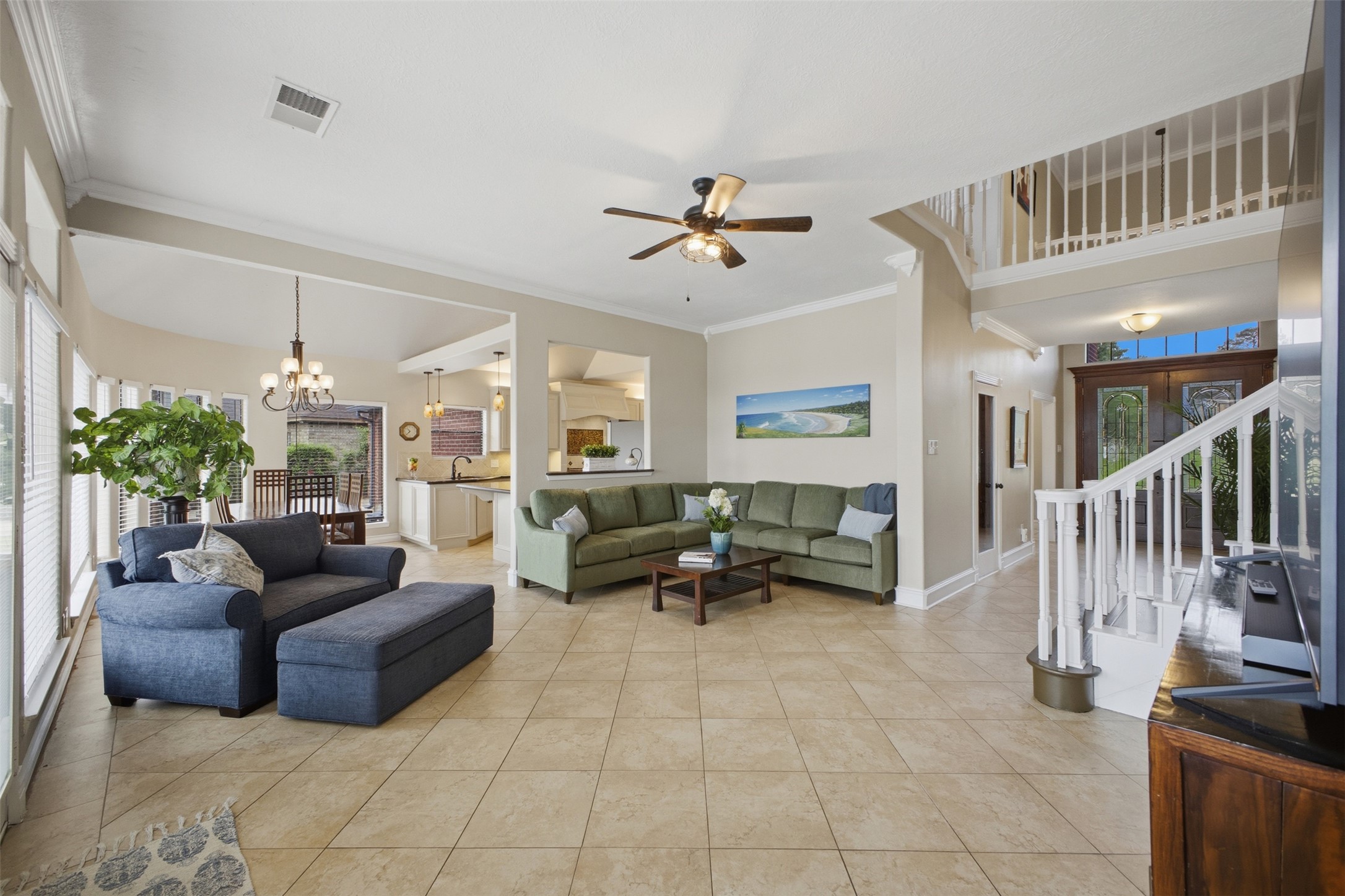 12710 Aries Loop Willis, TX 77318 - Photo 8 of 40 Spacious living area featuring tiled flooring, a ceiling fan, and large windows