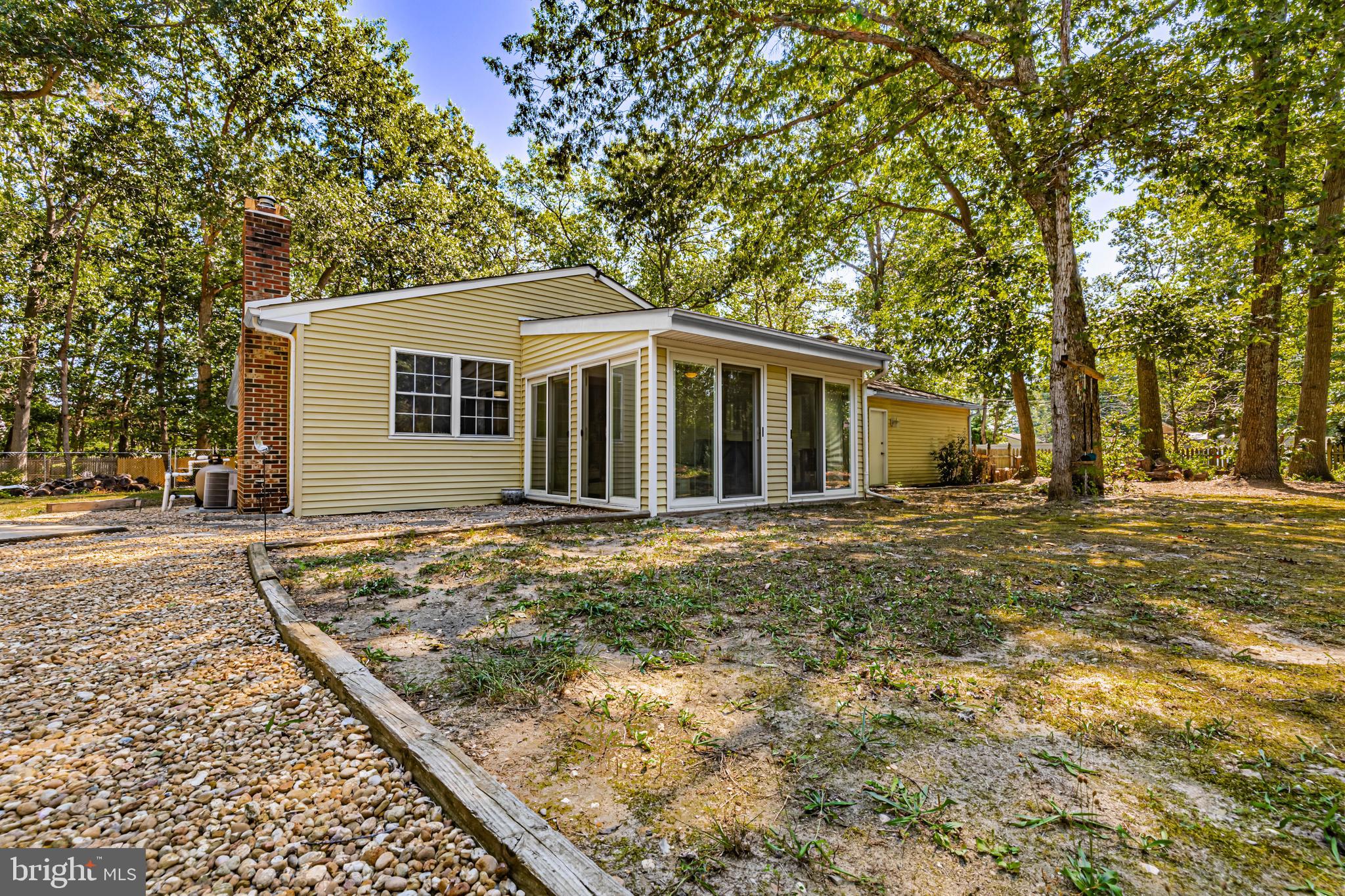 4 Oak Leaf Road Berlin, NJ 08009 - Photo 13 of 18 a view of a yard in front of a house with large trees