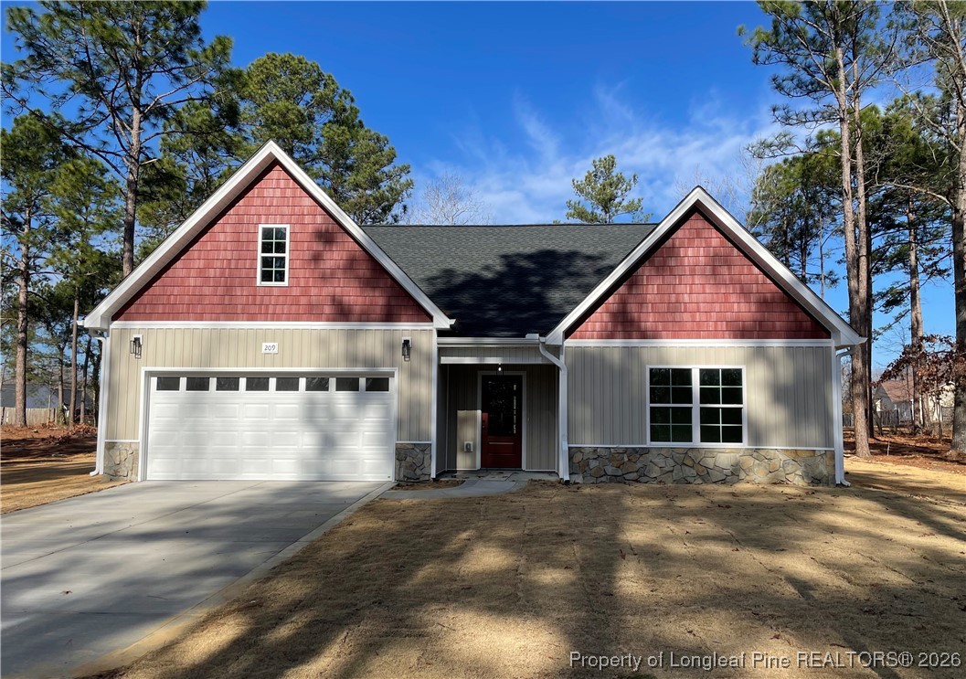 209 August Lane Raeford, NC 28376 - Photo 1 of 20 a view of a house with yard and plants