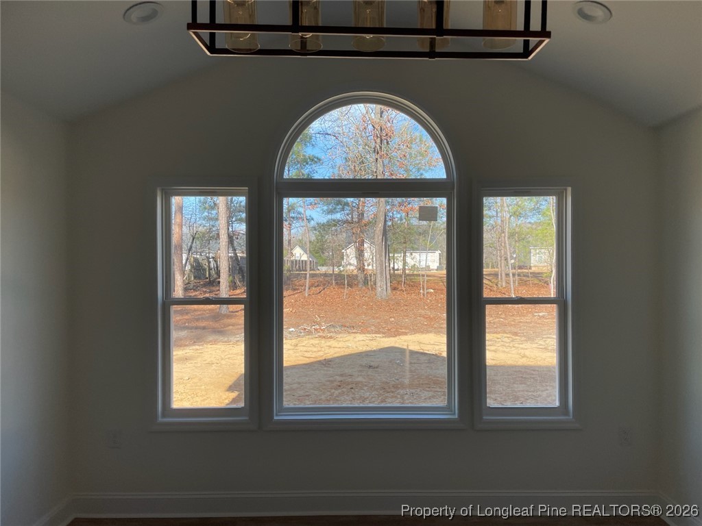 209 August Lane Raeford, NC 28376 - Photo 5 of 20 a view of empty room with large windows