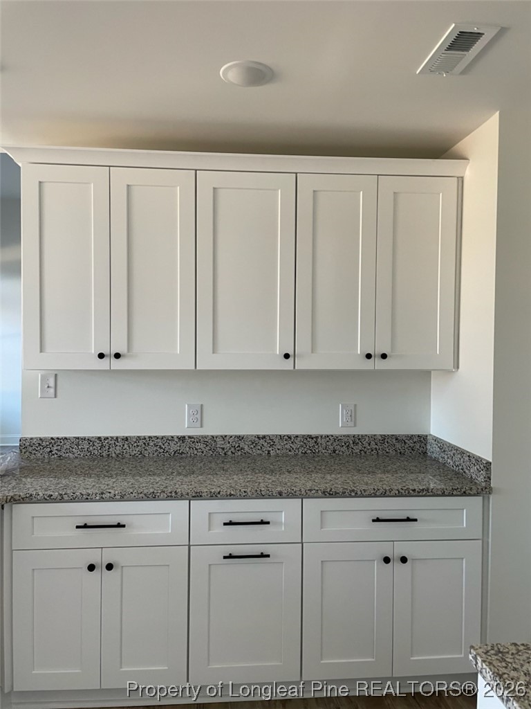 209 August Lane Raeford, NC 28376 - Photo 7 of 20 a kitchen with granite countertop white cabinets and granite counter tops