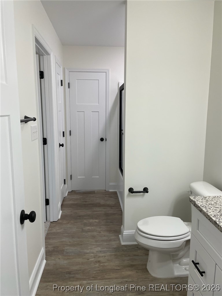 209 August Lane Raeford, NC 28376 - Photo 10 of 20 a bathroom with a toilet and a shower
