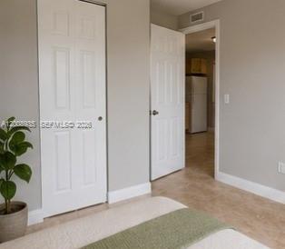 948 Southwest 3rd Street, Unit 205 Miami, FL 33130 - Photo 7 of 11 an empty room with windows and closet