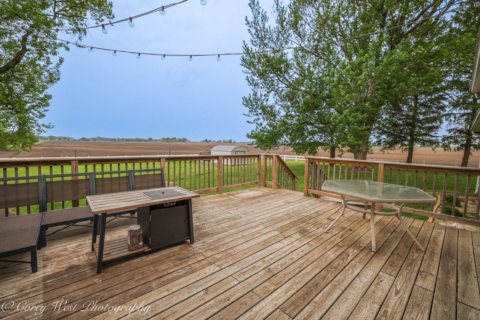 8994 Highway 64 Sycamore, IL 60178 - Photo 7 of 37 a view of a balcony with wooden floor and outdoor seating