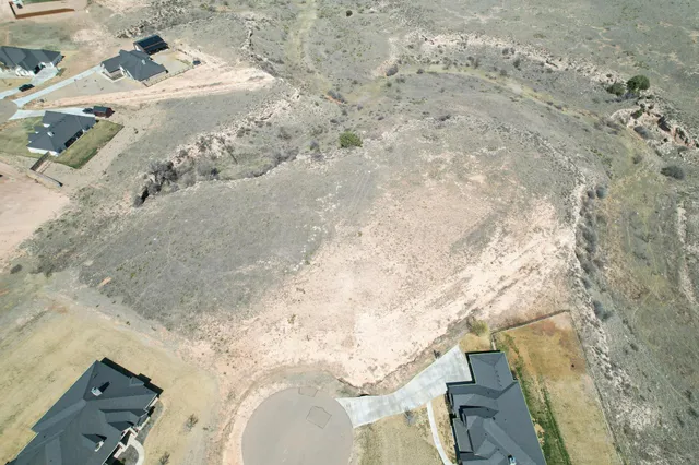 an aerial view of a house with beach