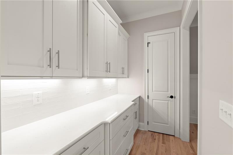 222 Trecastle Square, Unit 21 Canton, GA 30114 - Photo 11 of 45 a view of a kitchen with white cabinets