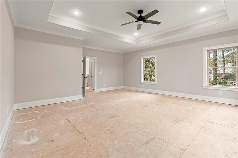 222 Trecastle Square, Unit 21 Canton, GA 30114 - Photo 23 of 45 an empty room with windows and fan