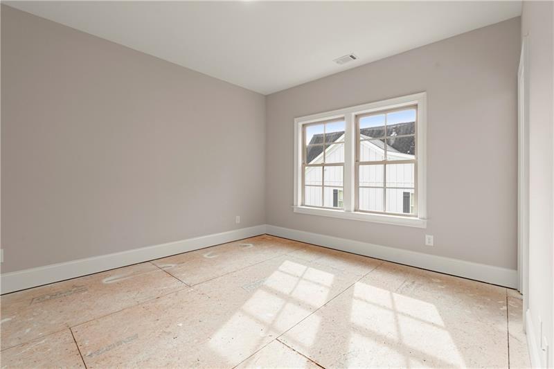 222 Trecastle Square, Unit 21 Canton, GA 30114 - Photo 29 of 45 a view of an empty room with a window