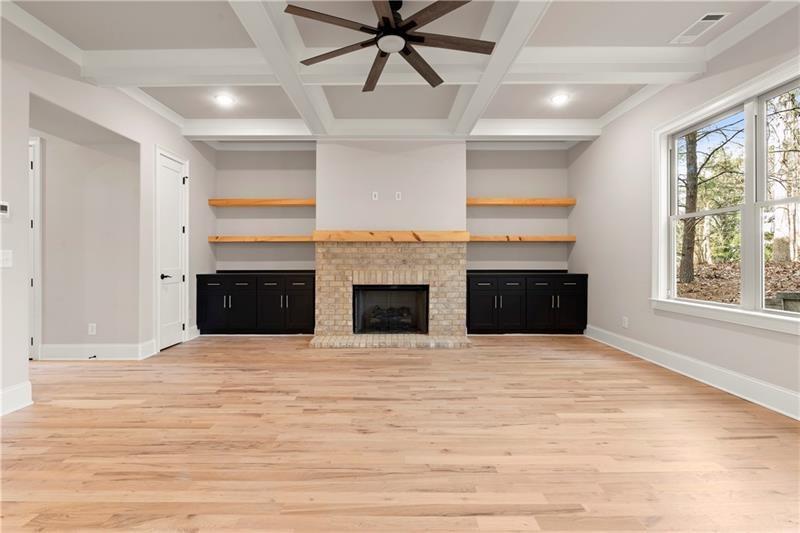 222 Trecastle Square, Unit 21 Canton, GA 30114 - Photo 3 of 45 a view of an empty room with a fireplace and a window