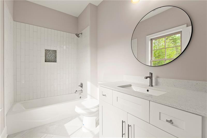 222 Trecastle Square, Unit 21 Canton, GA 30114 - Photo 31 of 45 a bathroom with a sink a toilet and a mirror