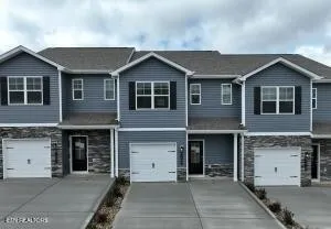 a front view of a house with yard
