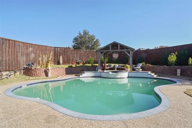 a view of a swimming pool with chairs
