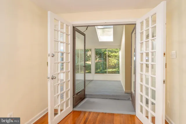 a view of bathroom with tub and window
