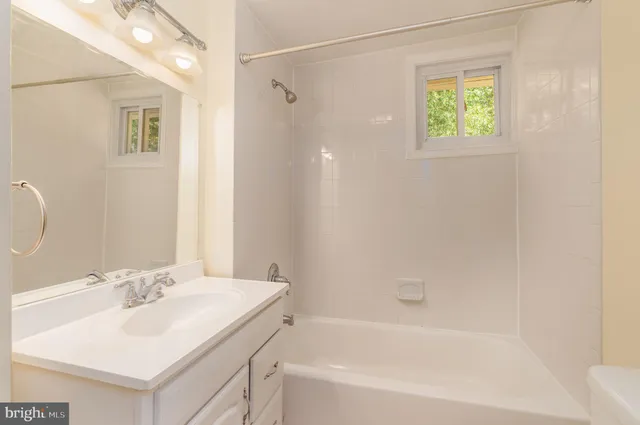a bathroom with a sink and a bathtub