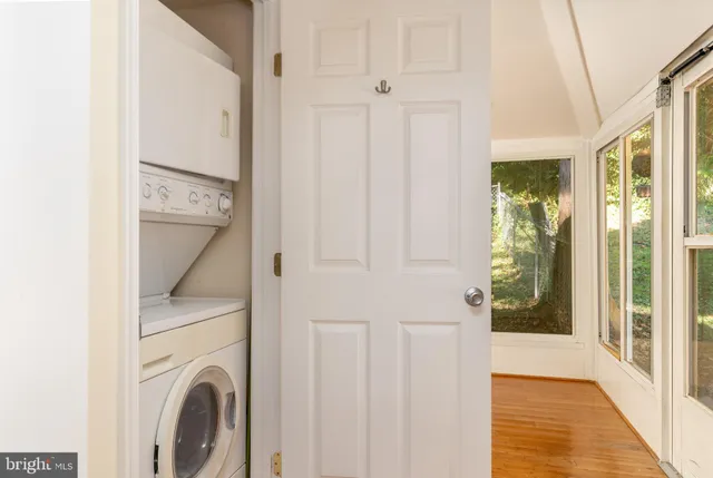 a view of a hallway with washer and dryer