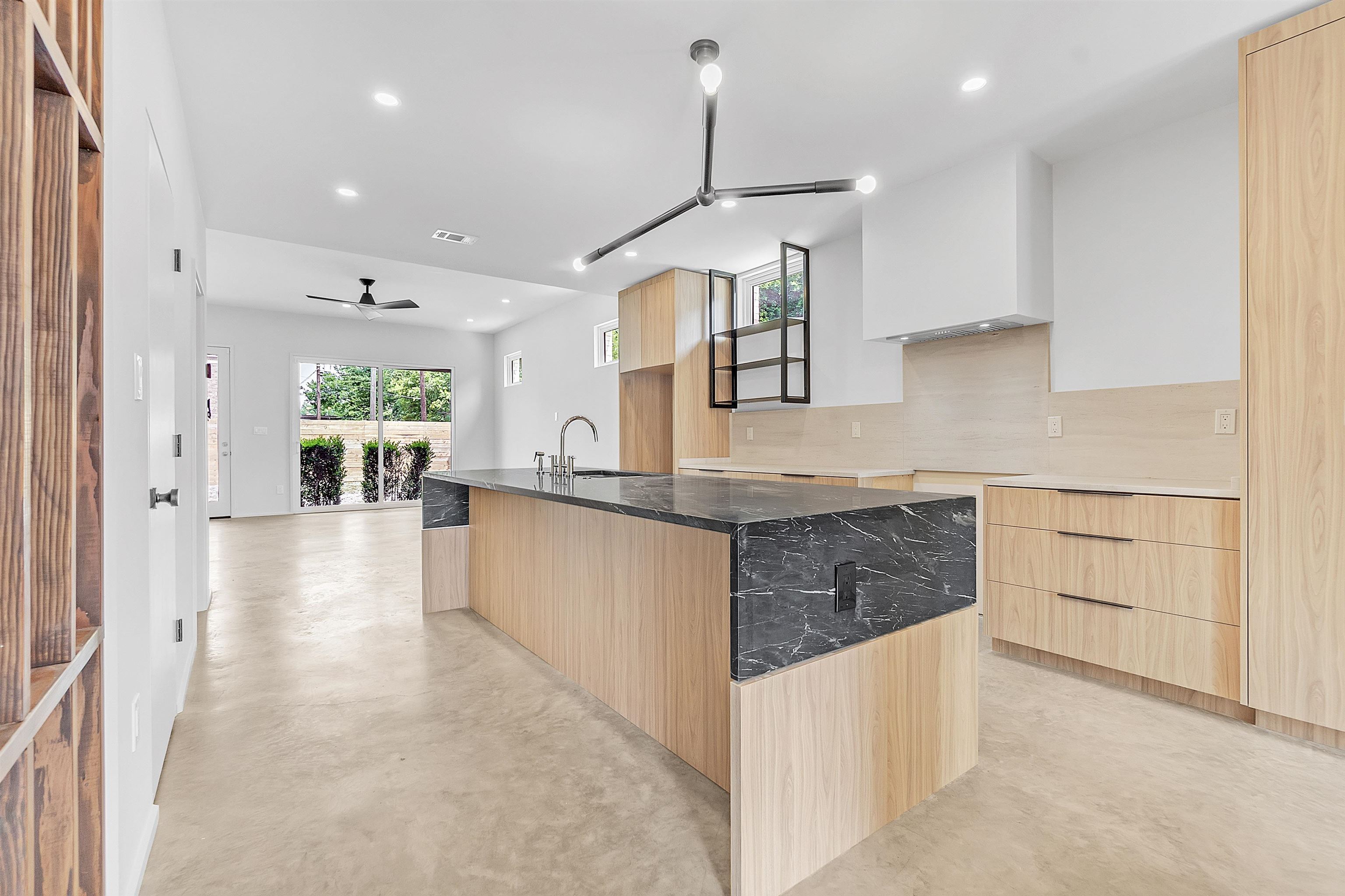 38 Angelus Street Memphis, TN 38104 - Photo 23 of 39 a large kitchen with stainless steel appliances kitchen island granite countertop a refrigerator a stove and a sink