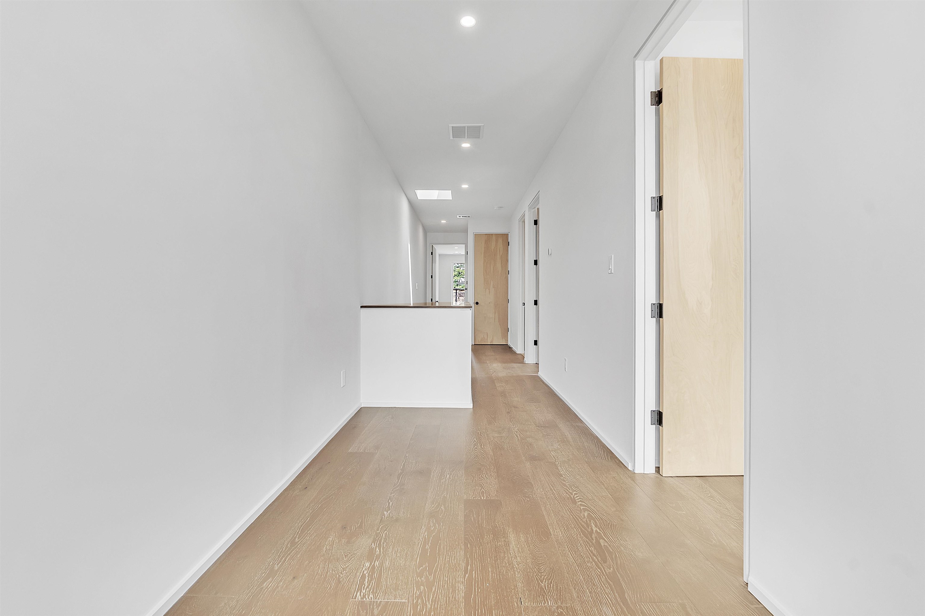 38 Angelus Street Memphis, TN 38104 - Photo 10 of 39 a view of a hallway with wooden floor